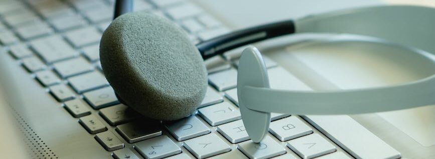 close up view of a laptop and a headset